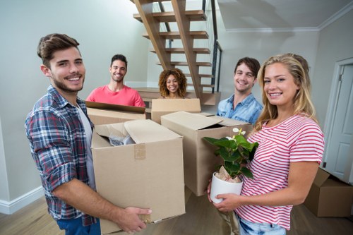 Student removal van helping with a move in Sutton residential street
