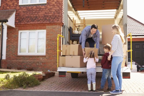 House removal team planning a move in Sutton with boxes and furniture
