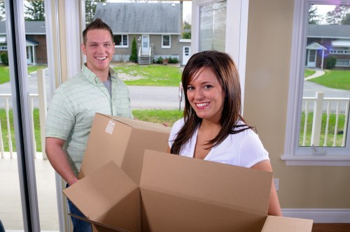 Careful loading of office items during a relocation in Sutton