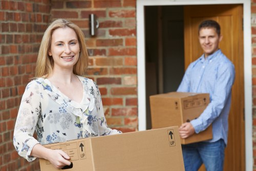 Local removals team loading furniture for a move in Sutton