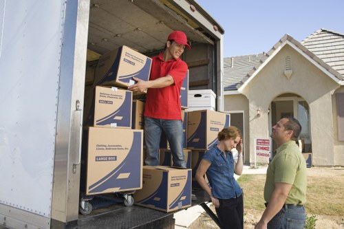 Careful unloading of household items at a Sutton home