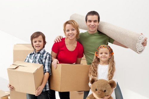 Packed boxes and furniture prepared for a home move in Sutton