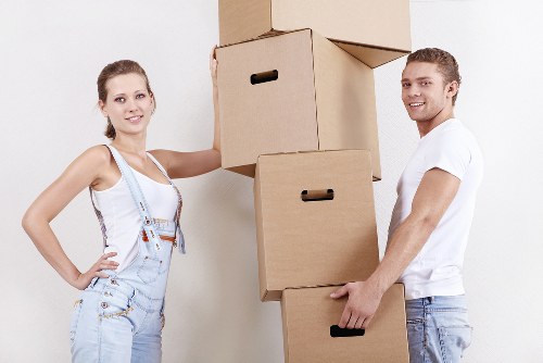Local movers organising boxed belongings during a Sutton property relocation